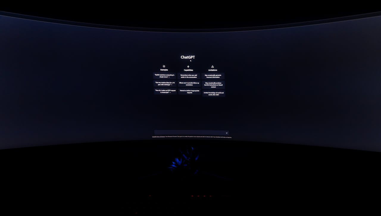 services-03 A dimly lit computer screen showing the ChatGPT interface in a dark setting.